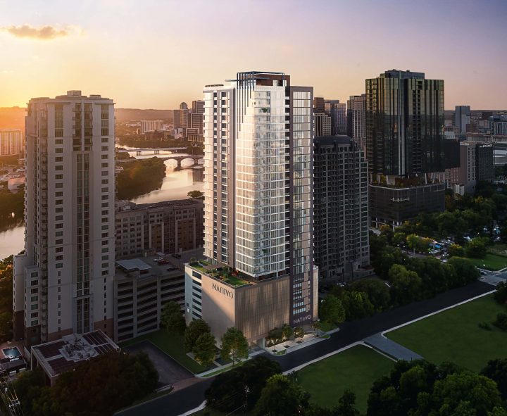 aerial view of Natiivo Austin 33-story building exterior at sunset with views of Colorado River Lady Bird Lake